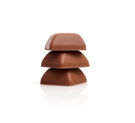 Pieces of natural chocolate isolated on white background