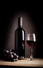 wineglass and bottle with grape