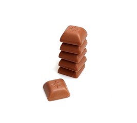 Pieces of natural chocolate isolated on white background