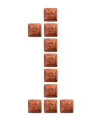 Figures from pieces of natural chocolate isolated on white background