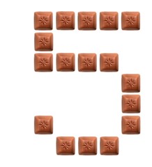 Figures from pieces of natural chocolate isolated on white background