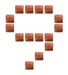 Figures from pieces of natural chocolate isolated on white background