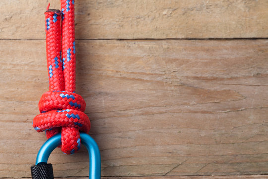 Fishermans Knot with Red Rope on Carabiner with copy space