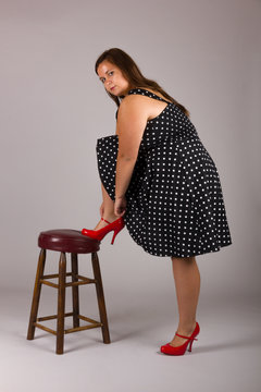 Beautiful Curvy Teenage Girl in Polkadot Dress and Red Heels