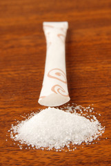 Sugar packet on a wooden table     