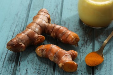 Fresh Turmeric root powder and Latte overhead view