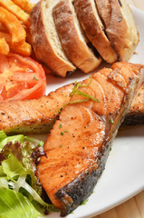 Fillets fried salmon with a side dish 