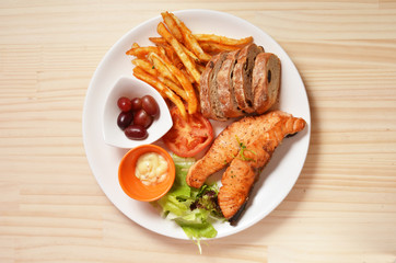 Fillets fried salmon with a side dish 