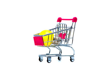 Mini shopping cart or supermarket trolley with yellow tungsten light bulb, isolated on white background, business finance shopping concept.