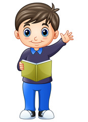 Happy little boy standing and holding a book