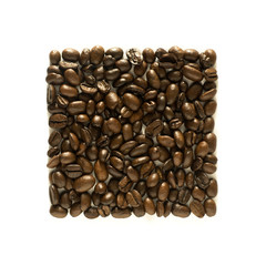 Neat square arrangement of coffee beans - isolated on white