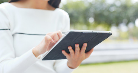 Woman holding with tablet computer