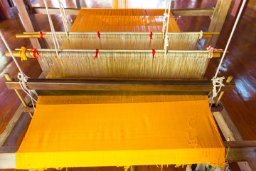Closeup - Detail of weaving loom for homemade silk or textile production, Thailand Sytle