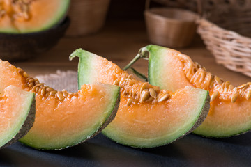 Melon slice on wooden table