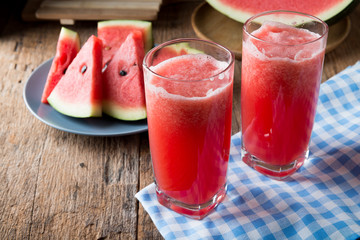 Watermelon smoothie on wood background
