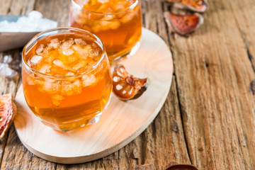 Bael juice ice tea on wooden table , healthy drink