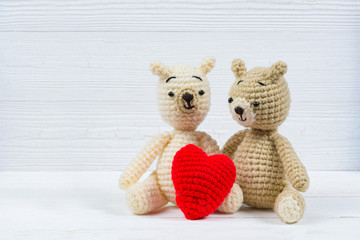 Couple teddy bear with red heart crochet knitting handmade, love and valentine concept idea.