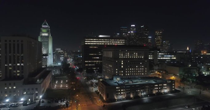 Cinematic urban aerial of downtown Los Angeles skyscrapers at night