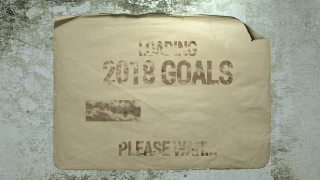 old paper ad on a cement wall with a progress bar inscription loading 2018 goals please wait. imitation of camera shake and light flashes.