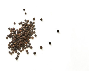 black peppers on white background