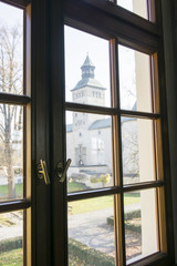 View of a window with a lock in the background.