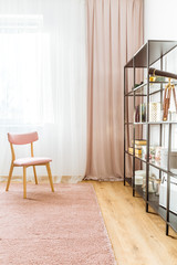 Pink wooden chair in interior