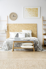 Gold painting in boho bedroom