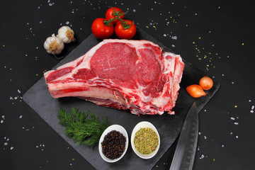 Raw Steak Beef on the Black Background