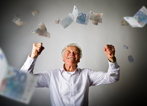 Old man in white and falling Euro banknotes
