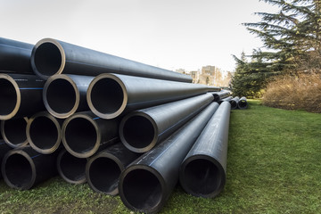 stack of PVC water pipes