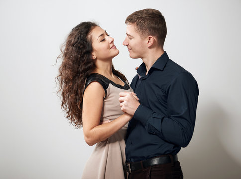 romantic couple posing on white background
