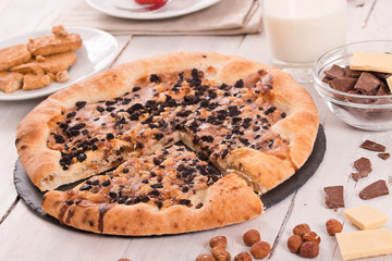 Sweet chocolate pizza with cookies. 