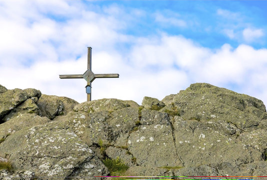 Wooden cross on the summit of a mountain Grosser Osser in National park Bavarian forest, Germany.