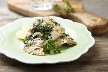 Baked fish with lemond and herbs