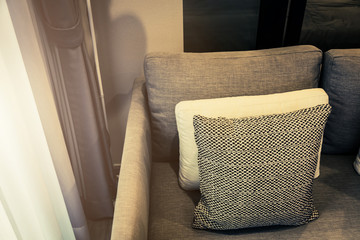 contemporary interior of Living room with part of sofa in sunny day and white curtain interior background concept