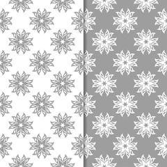 White and gray floral backgrounds. Set of seamless patterns
