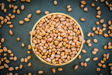 Peanuts in wooden bowl