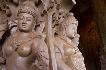 The sanctuary is an all-wood building filled with sculptures based on traditional Buddhist and Hindu motifs.