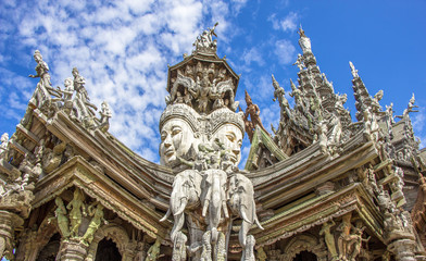 Fototapeta na wymiar Sanctuary of Truth is a temple construction in Pattaya, Thailand. The sanctuary is an all-wood building filled with sculptures based on traditional Buddhist and Hindu motifs.
