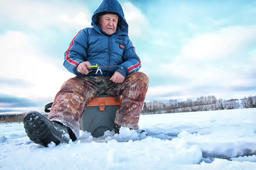 Fototapeta na wymiar Lake Winter Fisherman