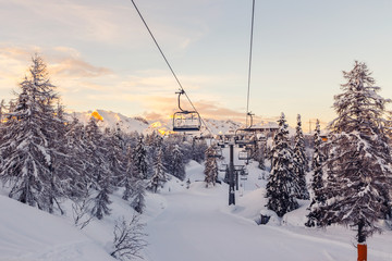 Winter mountains panorama with ski slopes and ski lifts
