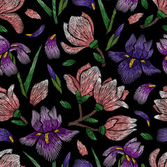 Naklejka premium Embroidery seamless floral pattern with iris and magnolia