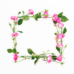 Obraz na płótnie Canvas Floral square frame made of pink roses, branches and leaves on white background. Flat lay, Top view. Flower composition
