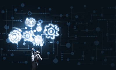 Glowing cogwheel mechanism icon on dark background as symbol of teamwork