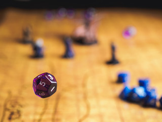 Roleplay game with dragons in dungeon. Yellow field dice