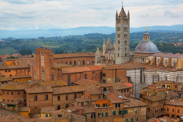 View of Siena Cathedral (Duomo di Siena) and Piazza del Duomo in Siena, Italy