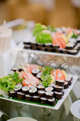 wedding catering food. mini canapes food.  tasty dessert. Beautiful decorate catering banquet table.  snacks and appetizers. wedding celebration