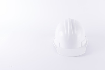 White safety helmet on white background. Hard hat and thick gloves on white isolated background. Safety equipment concept. Worker and Industrial theme.