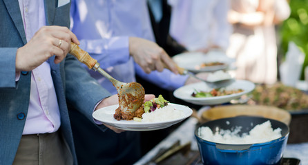 scooping the food. Buffet food at restaurant. Catering food