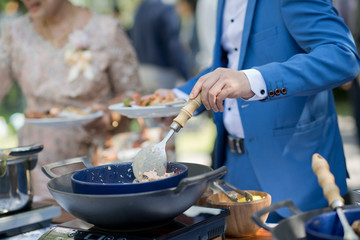 scooping the food. Buffet food at restaurant. Catering food